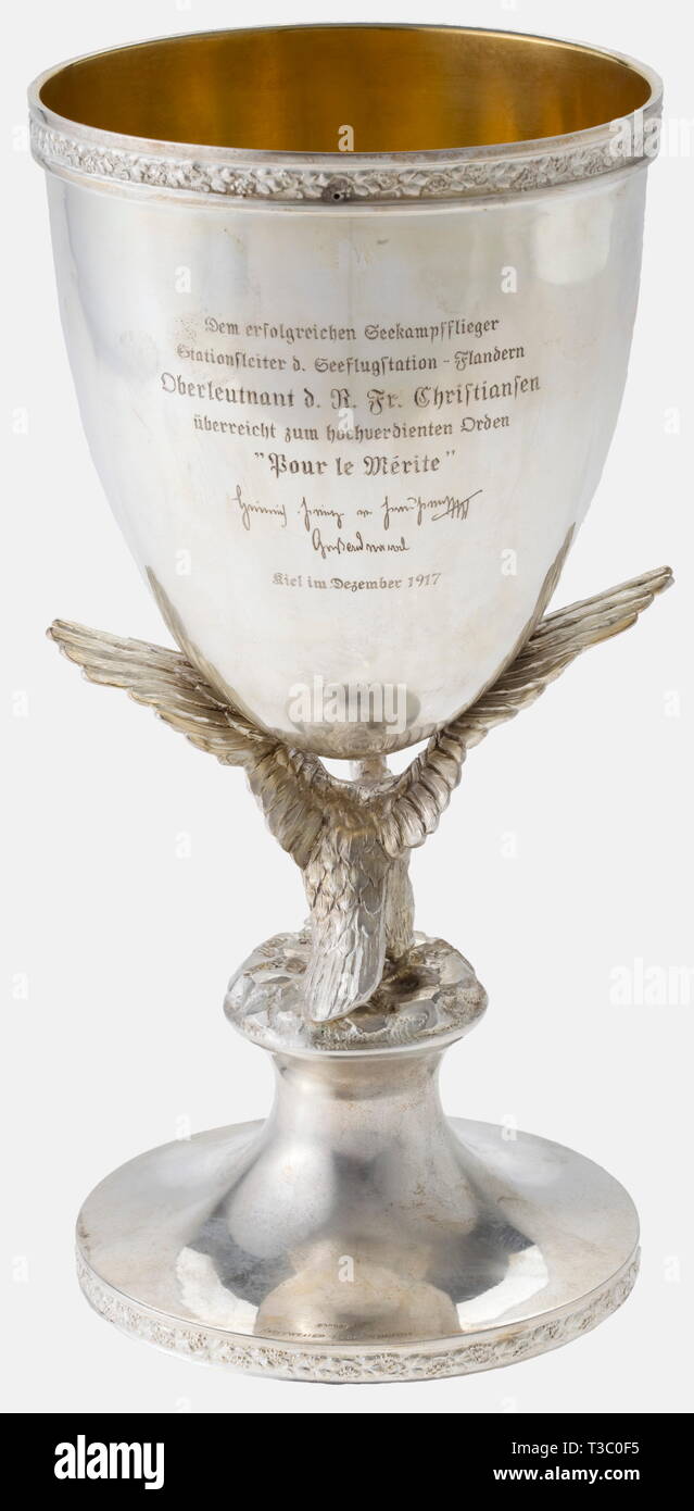 The following lots come from the estate of the most successful naval aviator of World War I, Friedrich Christiansen (1879 - 1972), later General der Flieger (Lt. General) in the Luftwaffe. During World War I, he first served in the 1st Torpedo Division. I, a silver cup commemorating the award of the Pour le mérite 1917 A present from Prince Heinrich of Prussia. Silver with gilt interior, paraboloid cup supported by the wings of a (likewise gilt) crowned Prussian eagle resting on a bell-shaped foot. The front engraved with the Prince's crowned monogram 'H', the reverse with , Editorial-Use-Only Stock Photo