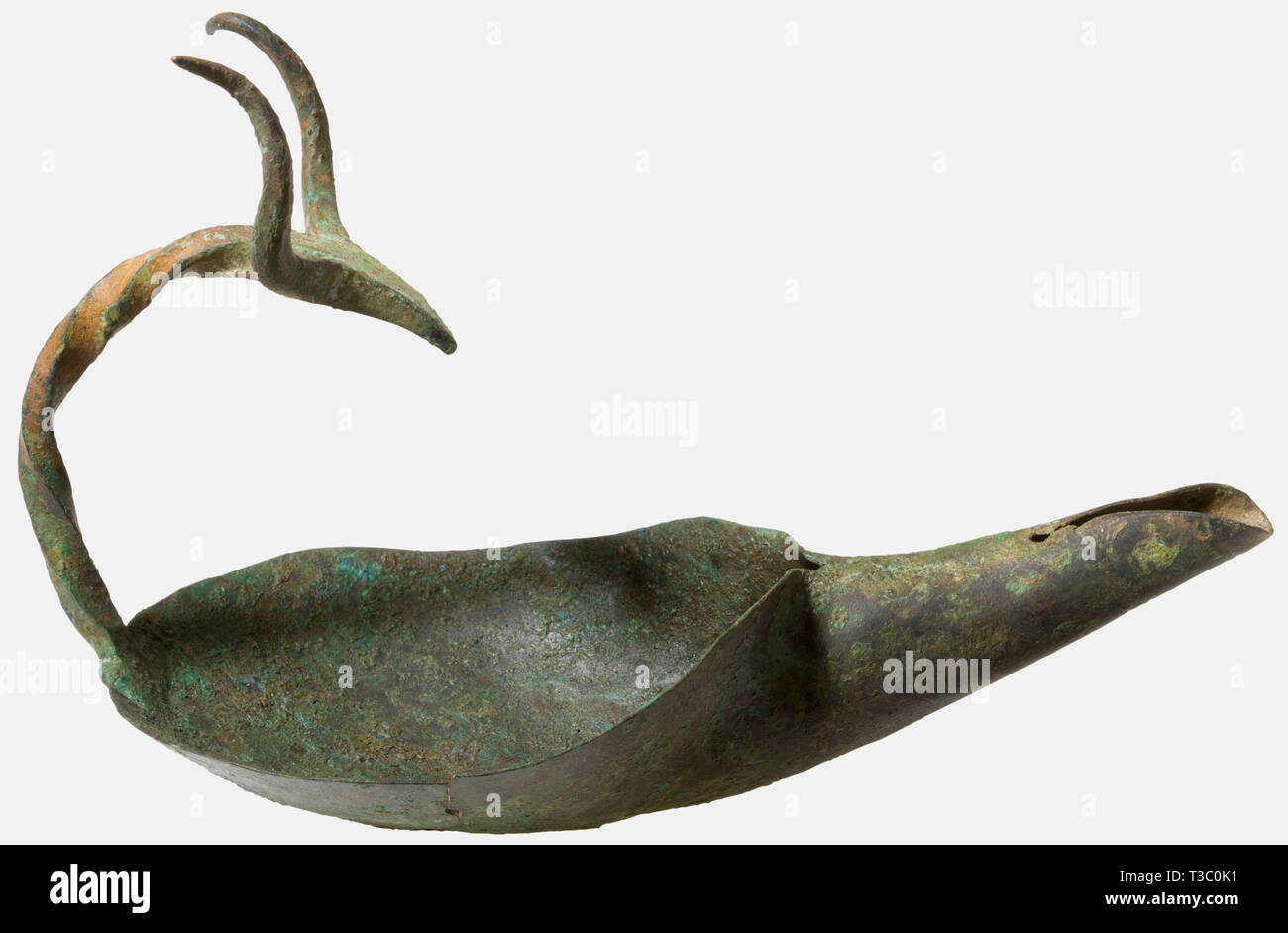 A single-spouted Celtic bowl lamp, 3rd - 1st century B.C. Bronze. Beautiful twisted and curved handle with stylised caprine head terminals. Height ca. 15.4 cm, length ca 24.1 cm. Strongly patinated, small crack in the bowl (ca. 6 cm). Small loss at the handle neck. historic, historical, ancient world, ancient world, ancient times, object, objects, stills, clipping, cut out, cut-out, cut-outs, Additional-Rights-Clearance-Info-Not-Available Stock Photo