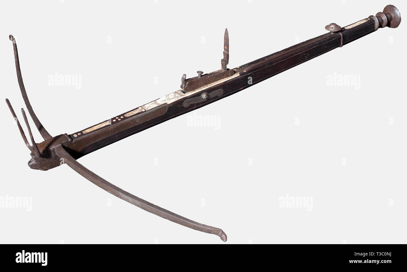 A Spanish pellet crossbow, 17th/18th century Iron prod. Walnut tiller with iron furniture and engraved bone inlays. Release and cocking mechanism with a folding peep sight on top. Iron parts with patina. Length 69 cm. historic, historical, 18th century, 17th century, crossbow, crossbows, distance weapon, weapons, object, objects, clipping, cut out, cut-out, cut-outs, Additional-Rights-Clearance-Info-Not-Available Stock Photo