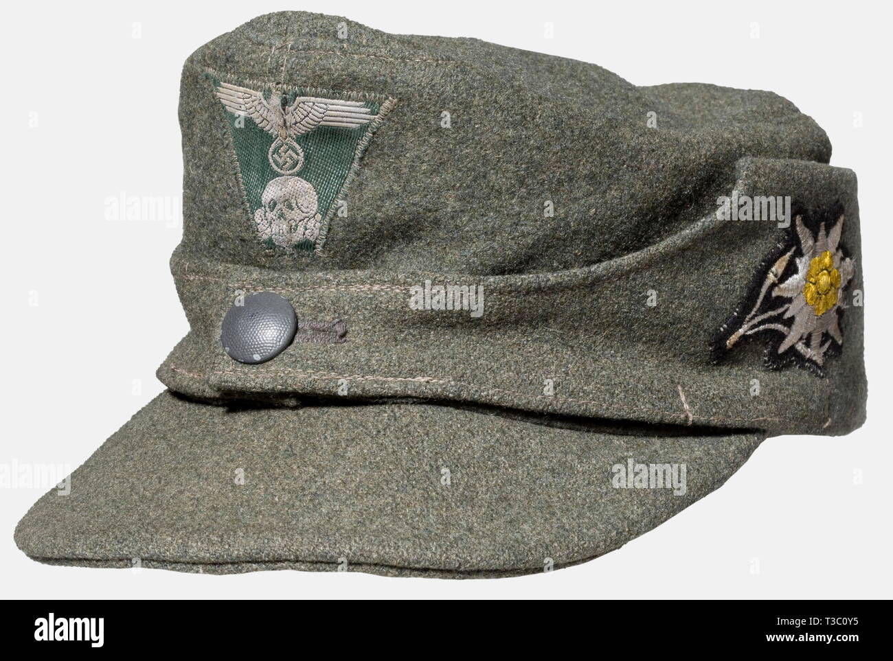 A field cap M 43 for enlisted men/NCOs, of the Mountain Troops Supply room item of field grey woolen material with a field grey lacquered button, machine-embroidered Edelweiß, trapeziform BeVo issue eagle. RBN and size stamp '57' in the artificial silk liner. historic, historical, 1930s, 20th century, Waffen-SS, armed division of the SS, armed service, armed services, NS, National Socialism, Nazism, Third Reich, German Reich, Germany, military, militaria, utensil, piece of equipment, utensils, object, objects, stills, clipping, clippings, cut out, cut-out, cut-outs, fascism, Editorial-Use-Only Stock Photo