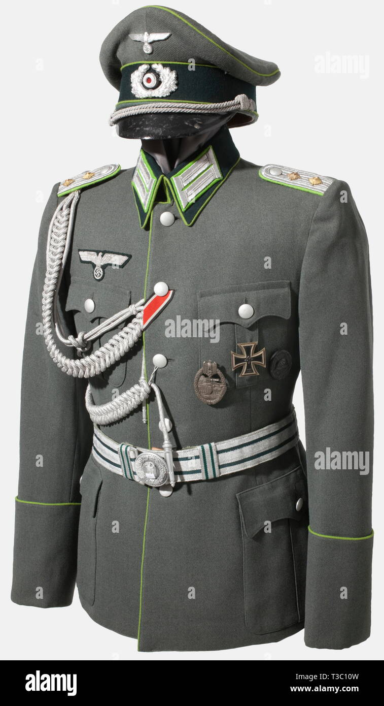 A uniform ensemble for a captain, of the Panzer Grenadiers Visor cap of field grey gabardine with dark green cap band, meadow green piping and aluminium insignia. Golden yellow silk liner with stamped manufacturer's label (hardly discernible) 'Offizierskleiderkasse Berlin - Erel Sonderklasse Extra', visor and sweatband of ersatz material, small moth hole. Decorated tunic of field grey gabardine with dark green collars and meadow green piping on fly and sleeve facings. Silver-embroidered eagle and collar tabs on meadow green backing, sewn-in shoulder boards, silvered cording, Editorial-Use-Only Stock Photo