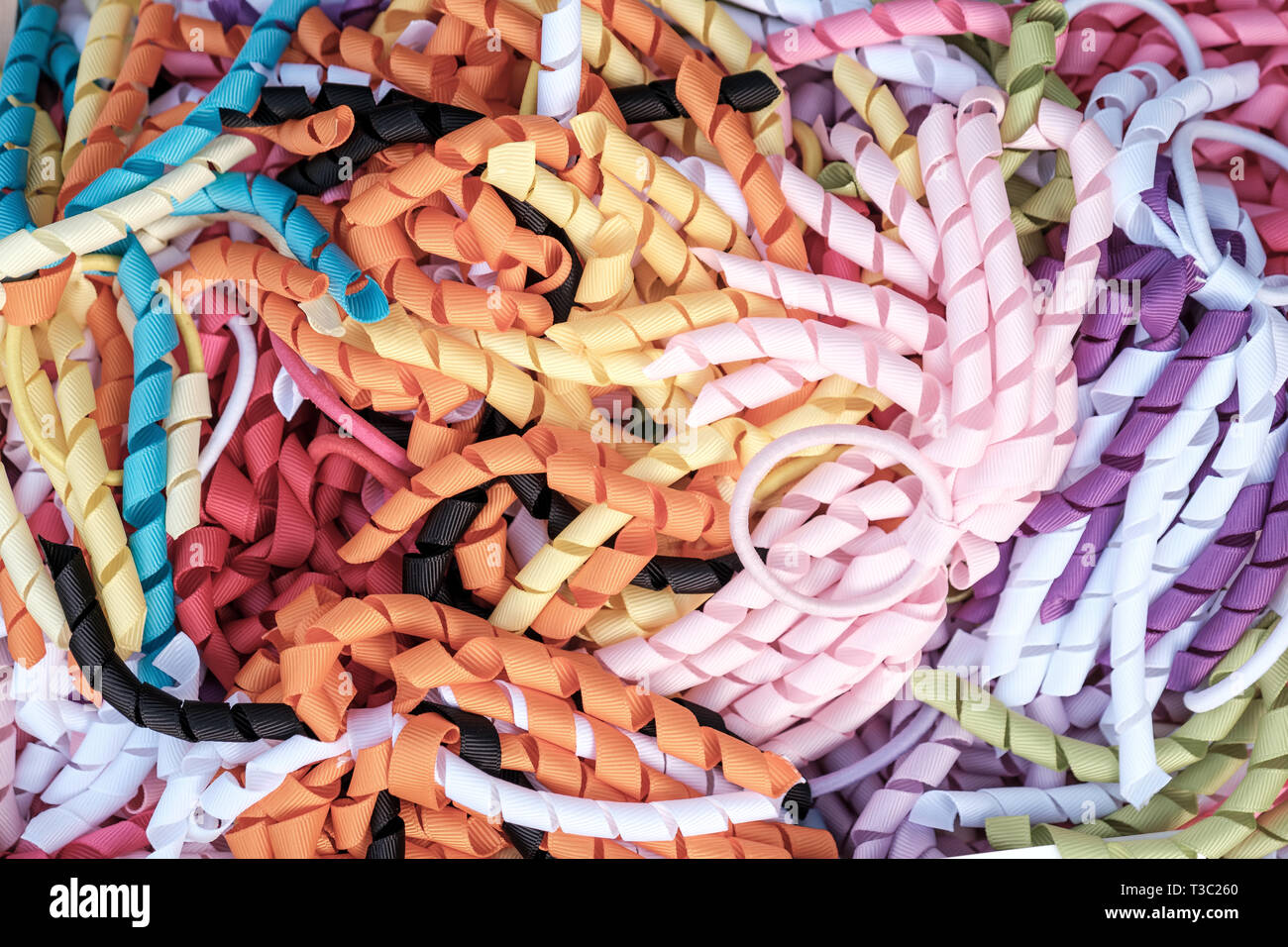Pastel colored handmade curly ribbon hair ties Stock Photo