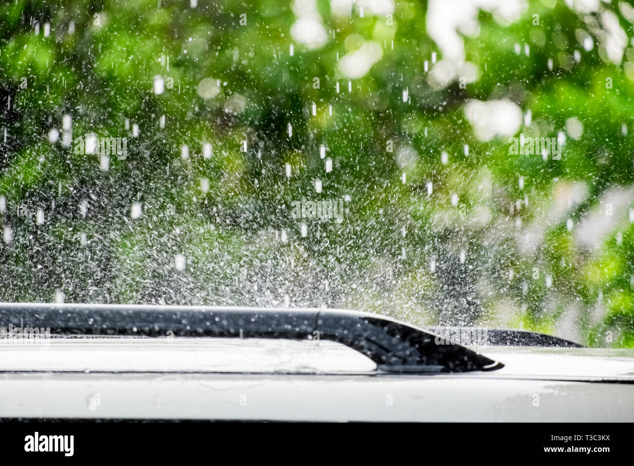 Raindrop falling on roof car Stock Photo Alamy
