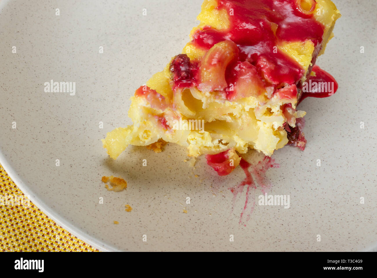 Half Eaten Piece Of Baked Macaroni Pudding Made With Cottage