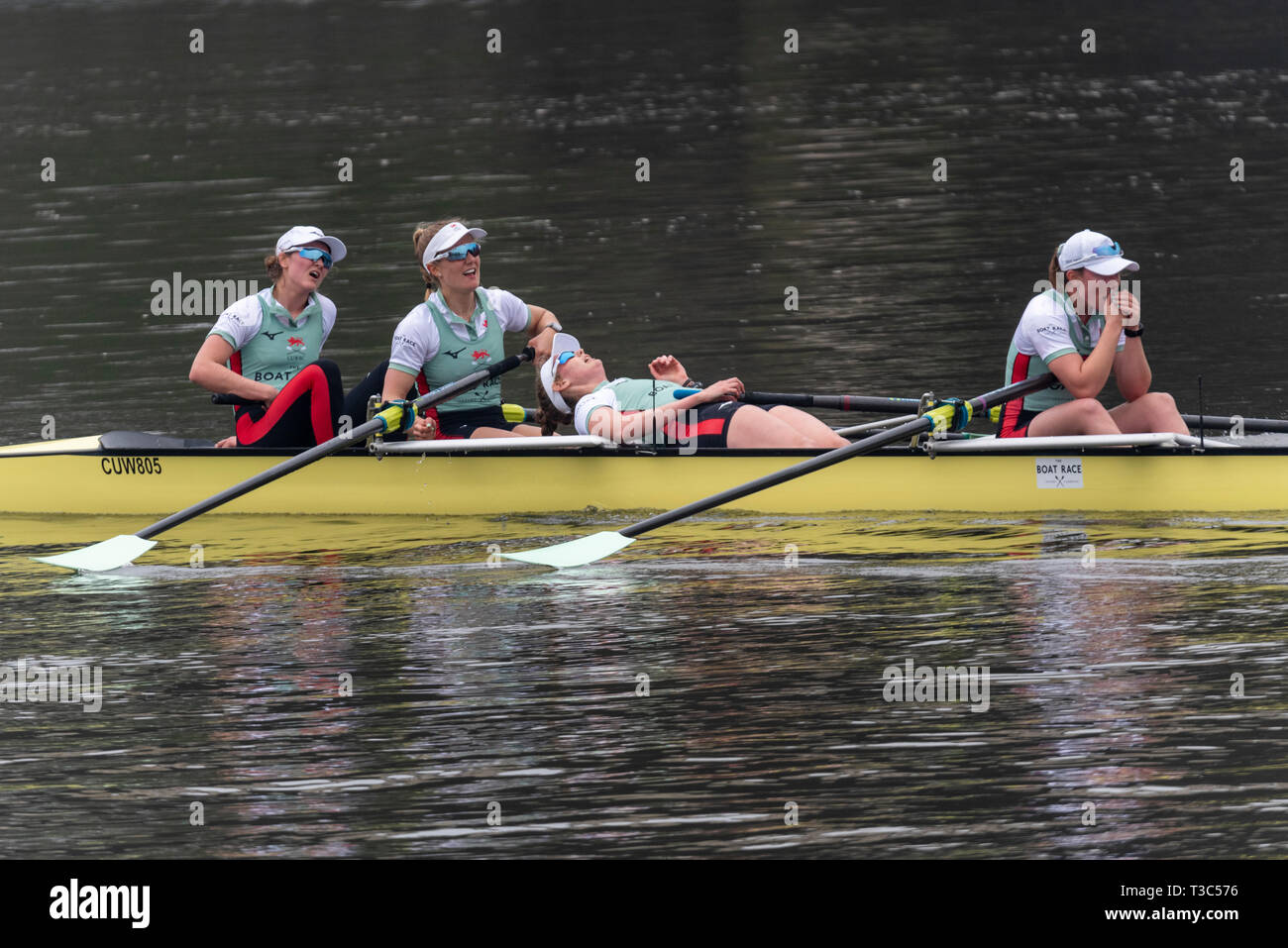 Women's Boat Race Cambridge winning boat team at the 2019 University Boat Race at the finish line Mortlake, London, UK. Exhausted Stock Photo