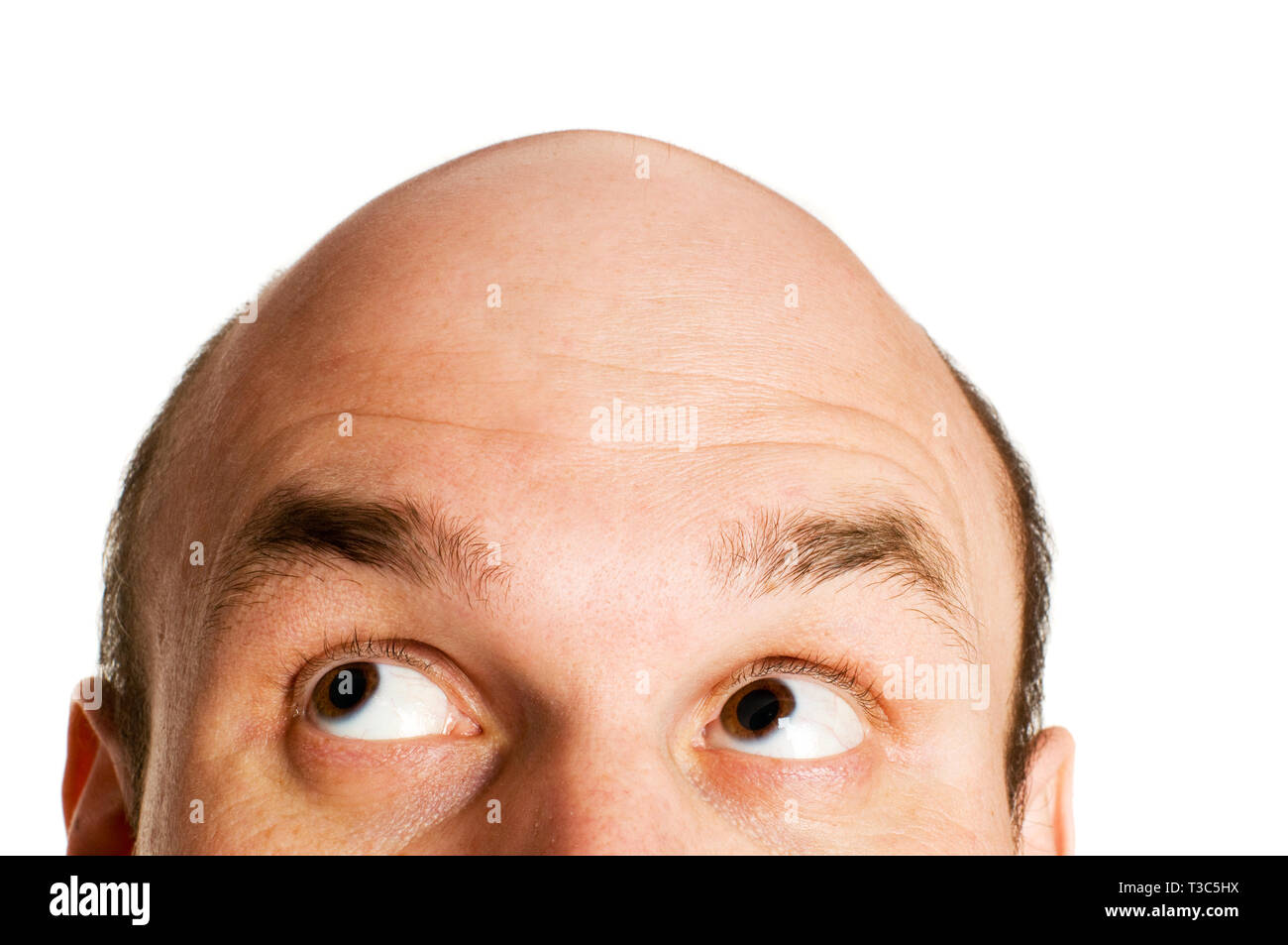 bald head looking up isolated Stock Photo