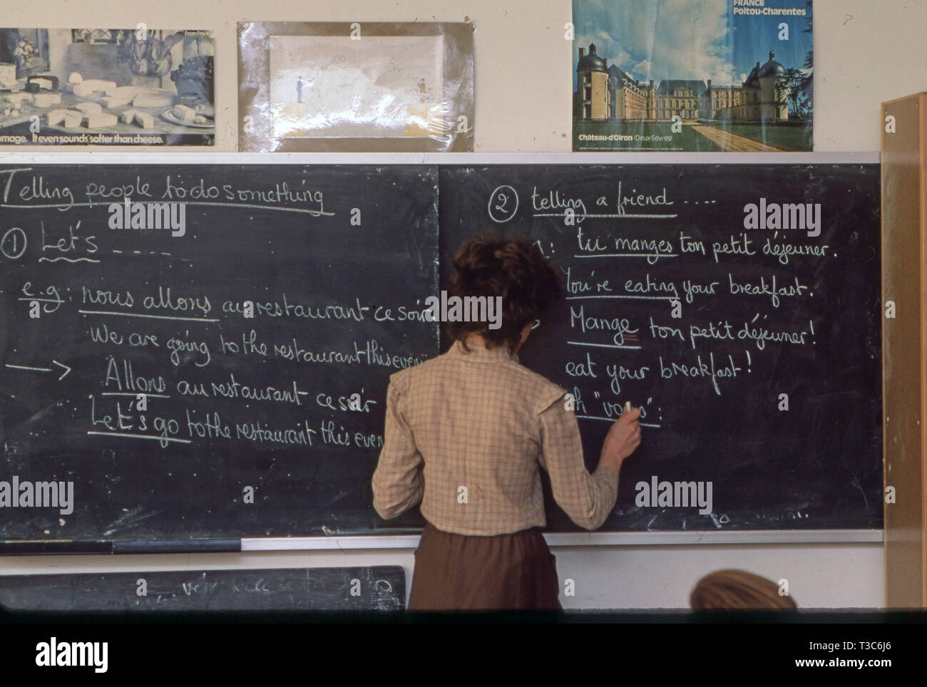 French teacher in the 1970's using a blackboard and chalk to teach