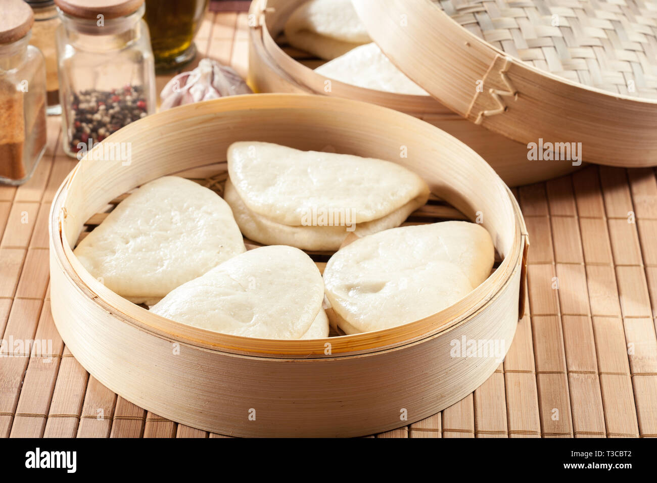 Gua bao, steamed buns in bamboo steamer. Asian cuisine Stock Photo