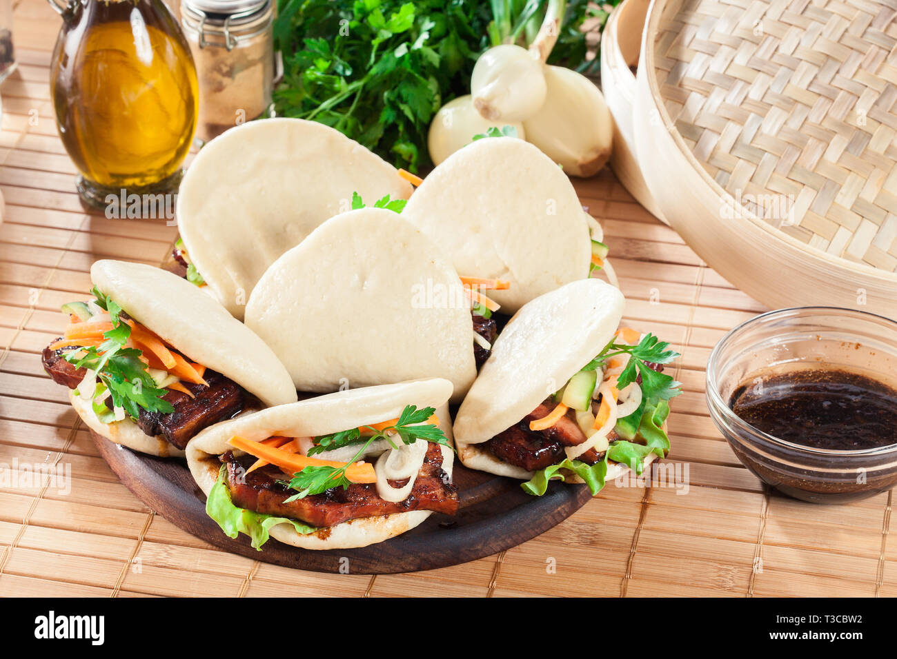 Gua bao, steamed buns with pork belly and vegetable. Asian cuisine Stock Photo