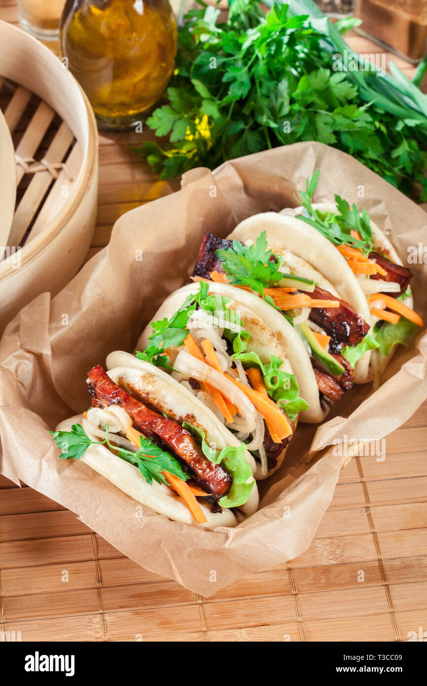 Gua bao, steamed buns with pork belly and vegetable. Asian cuisine Stock Photo