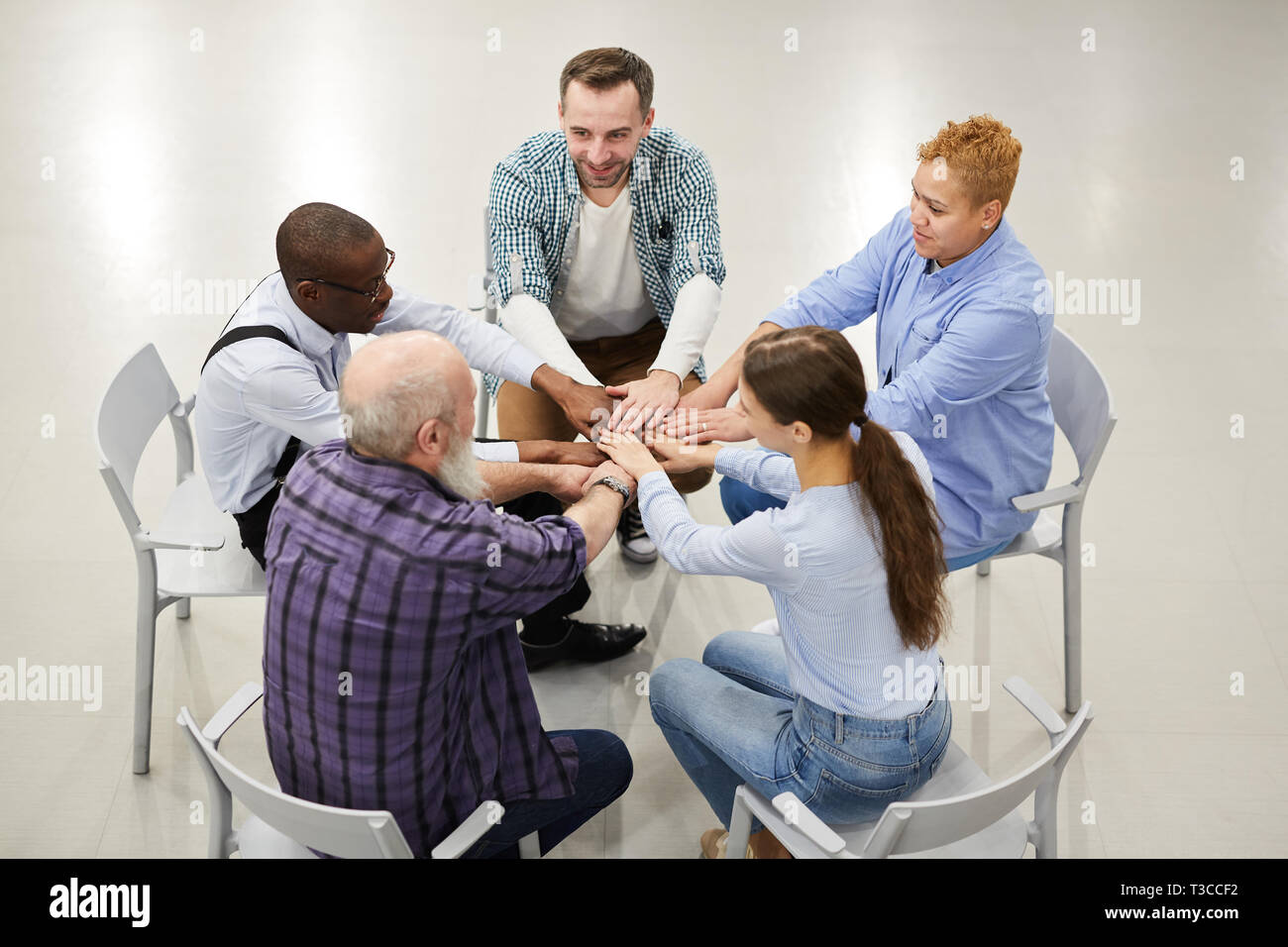 Supporti Group Joining Hands Stock Photo