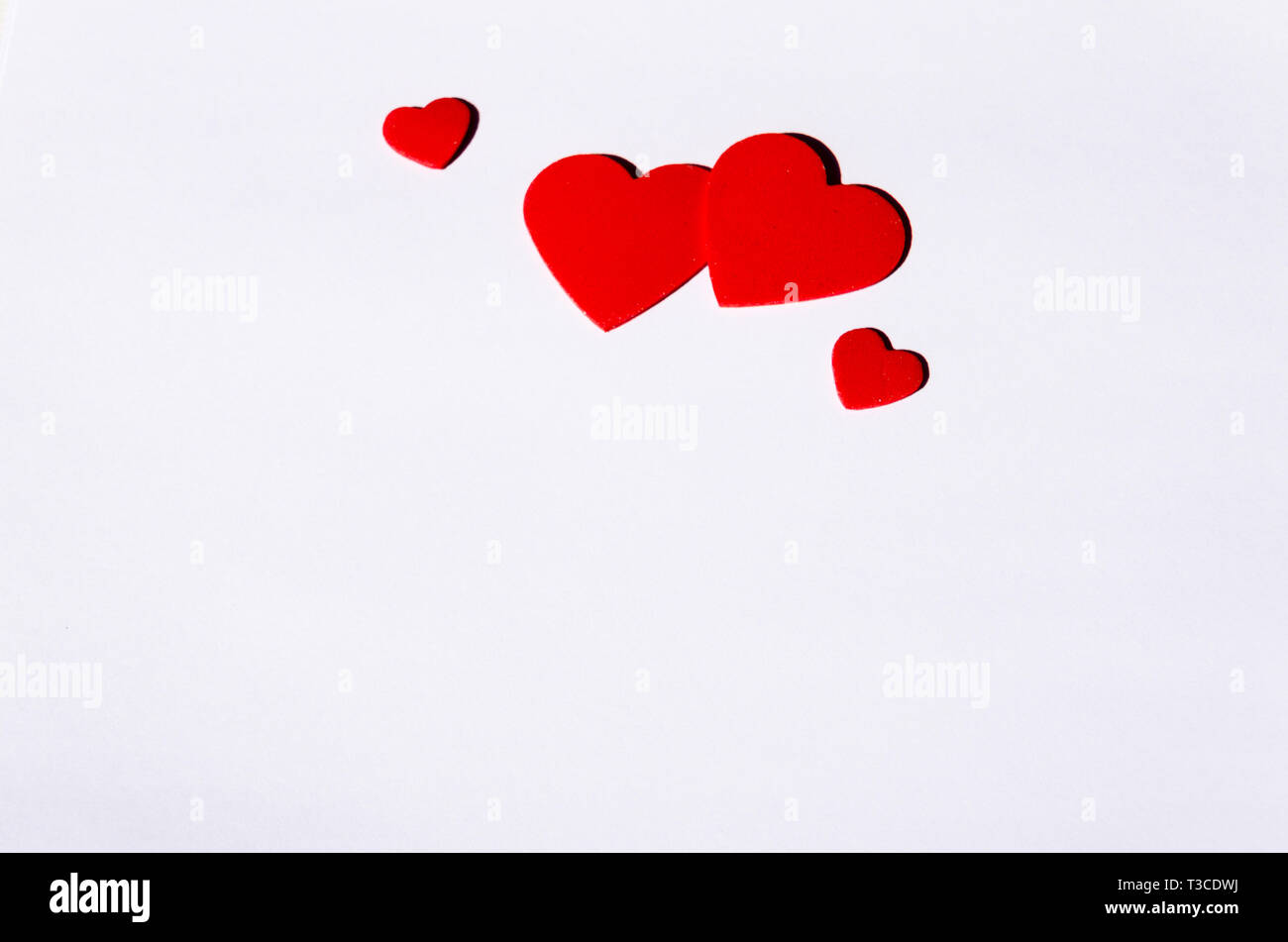 Postcard of red hearts on white background Stock Photo - Alamy
