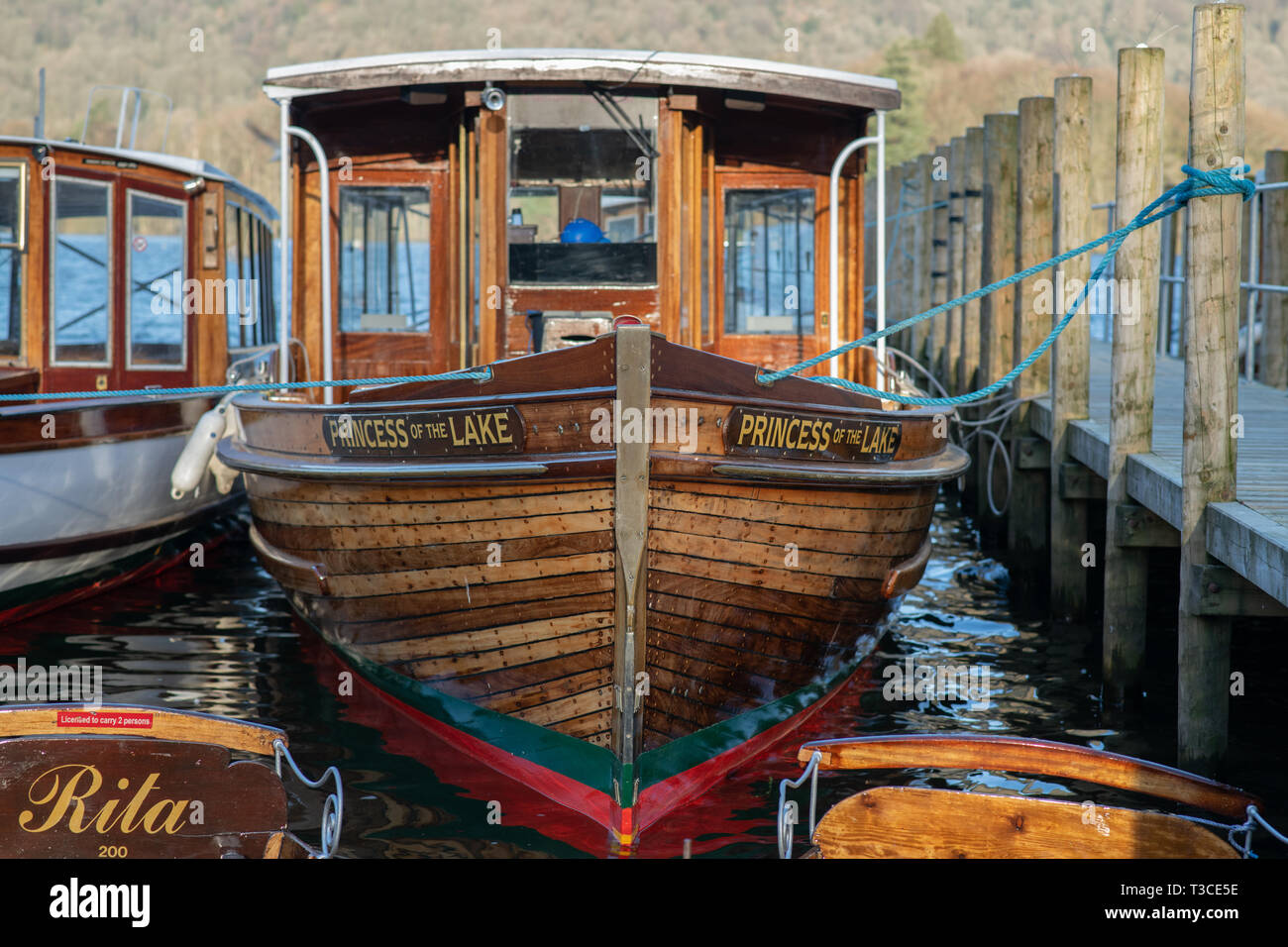 The tourist boat 'Princess of the Lake' sat docked during sunrise at Lake Windermere, Cumbria - March 2019 Stock Photo