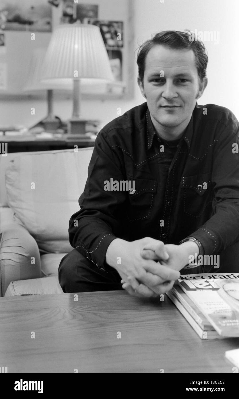 Nick Ashley when he was Head of Design at Laura Ashley, sitting in his