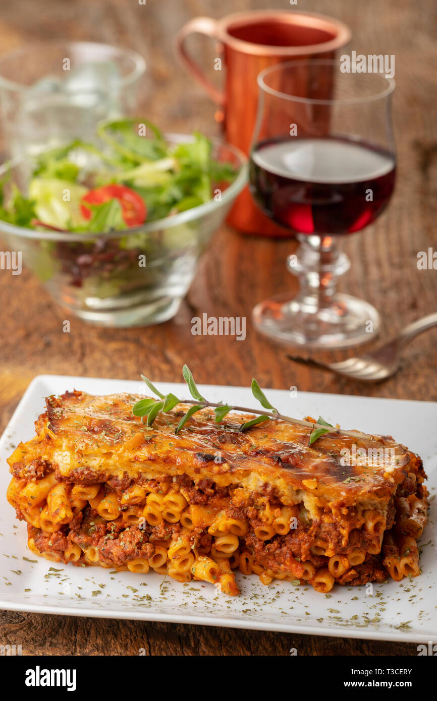 greek pastizio noodle dish with cheese Stock Photo - Alamy
