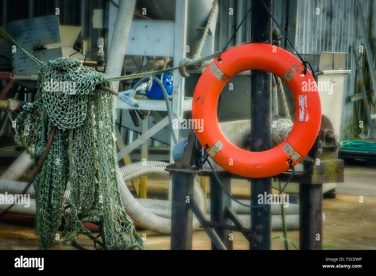 A life preserver and shrimp net are pictured at Dominick’s Seafood, March 4, 2017, in Bayou La Batre, Alabama. Stock Photo