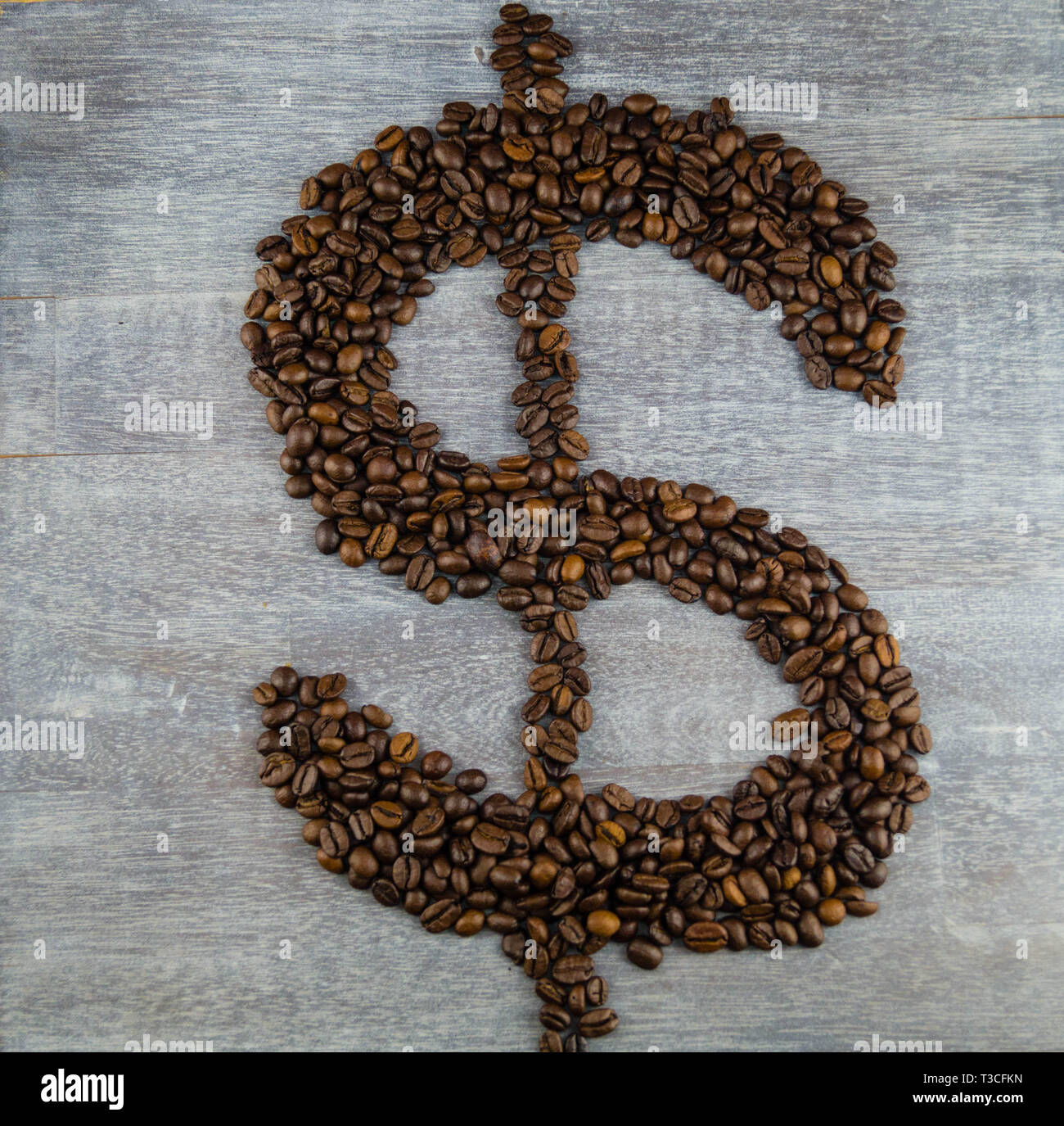 fair trade coffee Price roasted coffee beans and money Stock Photo