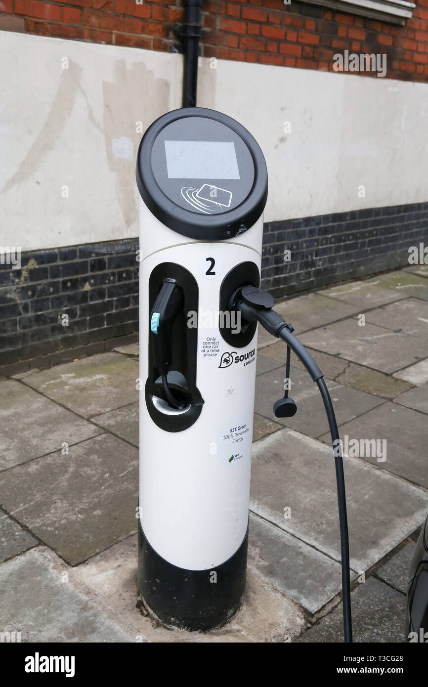 An electric car charging point is seen in London.  To help improve air quality, an Ultra-Low Emission Zone (ULEZ) which came into force on Monday 8 April 2019, now operates 24 hours a day, 7 days a week, within the same area of central London as the Congestion Charge.  Drivers must meet the ULEZ emissions standards or have to pay a daily charge, in addition to Congestion Charge to drive within the zone. Stock Photo