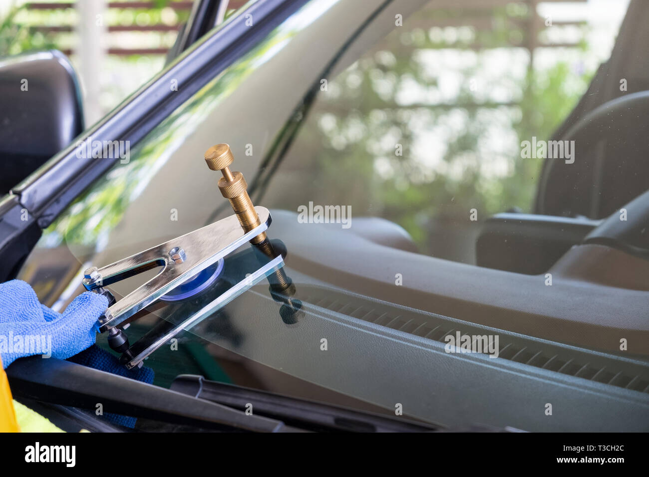 Using tools repairing to fix crack windshield Stock Photo Alamy