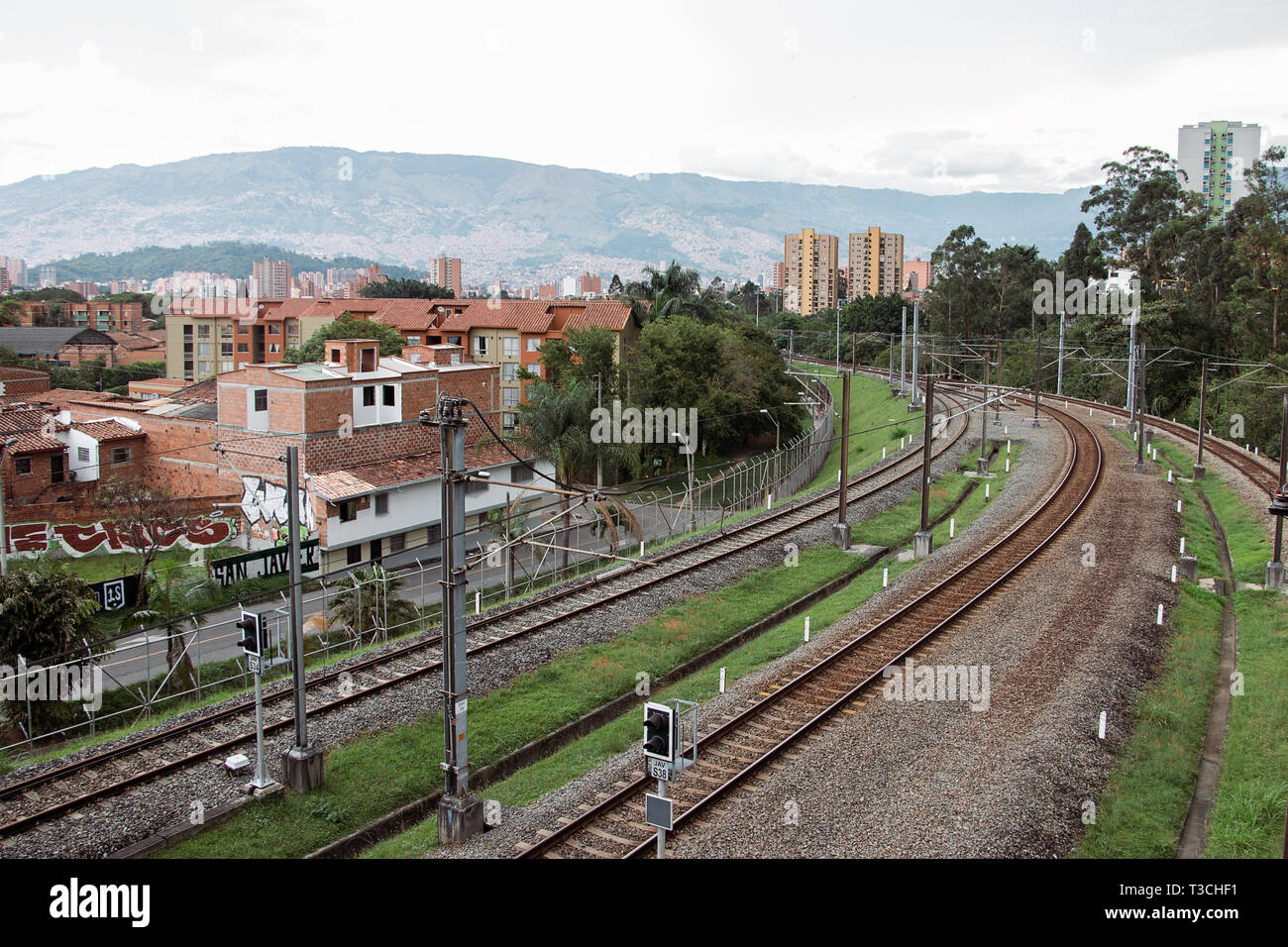 View of the train tracks and housing as seen from San Javier Metro station in Medellín (Medellin), Antioquia, Colombia Stock Photo