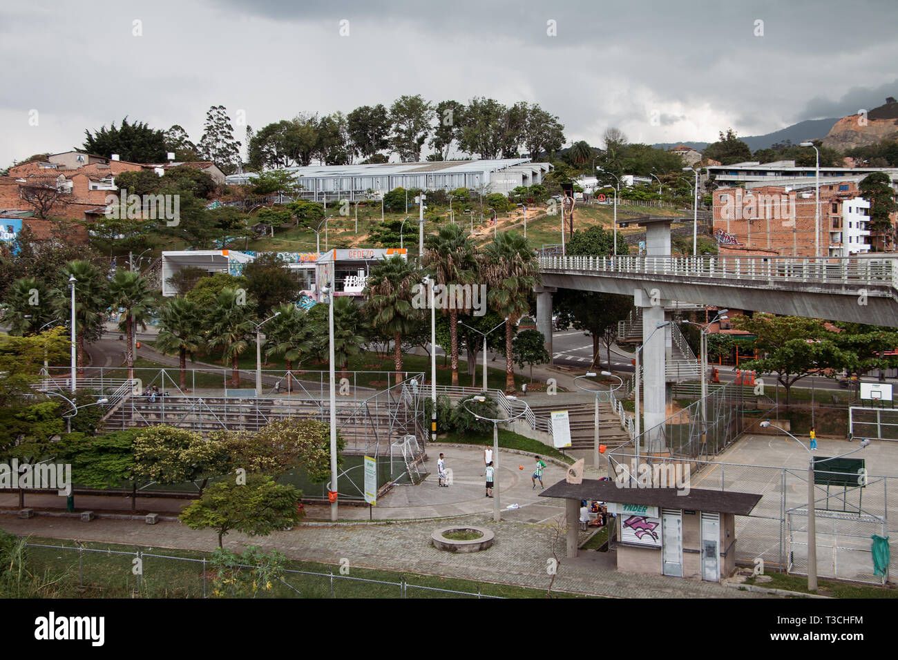 View of local INDER sports pitches and facilities and housing as seen from San Javier Metro station in Medellín (Medellin), Antioquia, Colombia. Stock Photo