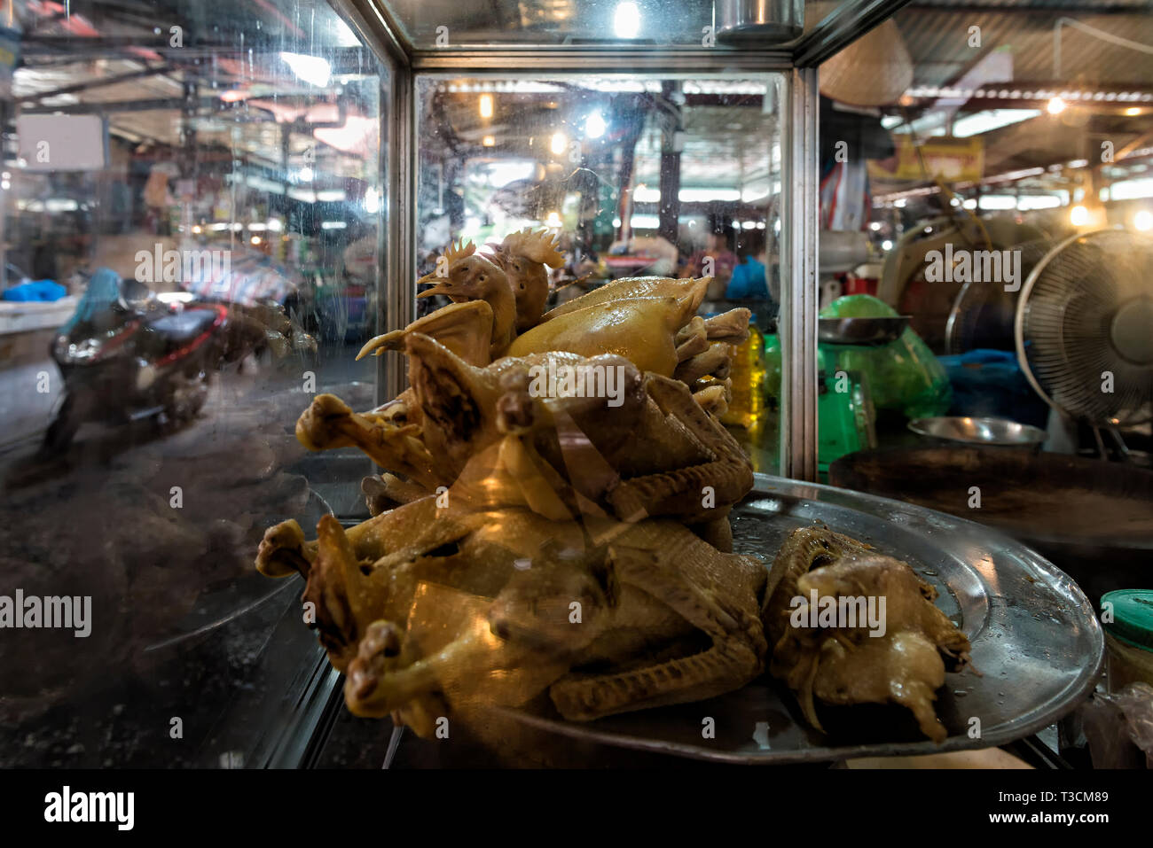 Display with whole roasted chickens in the food market in Hanoi Stock