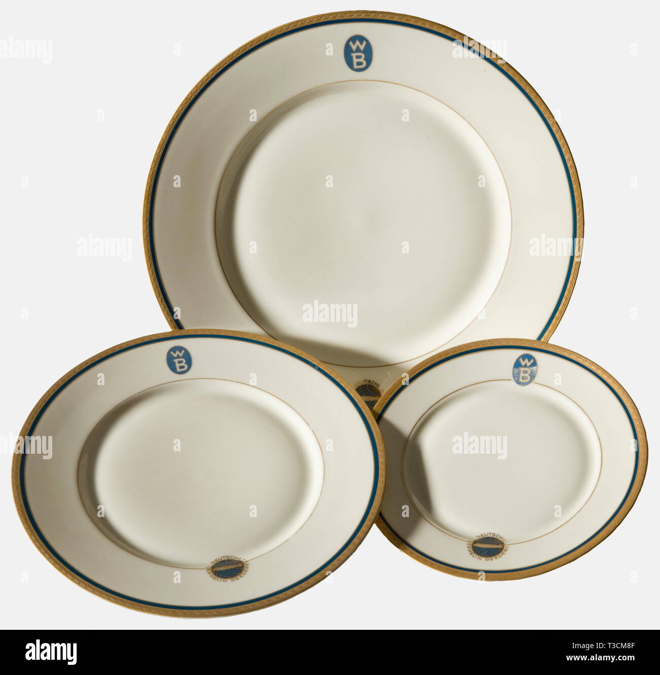 Three plates from the dining service, of the Zeppelin Shipping Line Each  with etched gold décor border set off in blue, the blue/gold emblem of the  Zeppelin Shipping Line with opposing "WB"