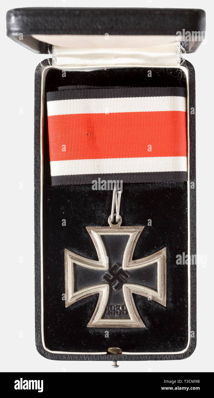 Knight's Cross of the Iron Cross 1939, manufacturer L/15, in its presentation case Blackened iron core in a polished silver frame, 'L/15' for maker Otto Schickle in Pforzheim punched in the eyelet (Nie 7.03.08 f2). Dimensions ca. 49.5 x 55.2 mm, weight ca. 25 g. Together with a ca. 55 cm length of neck ribbon, in a black award presentation case with obverse silver-stamped 'LDO', iron hinge, non-magnetic push button. Nearly unworn, the obverse somewhat toned, the ribbon with holes from thumbtacks. The consigner states this award was acquired from the family of Generalleutnan, Editorial-Use-Only Stock Photo