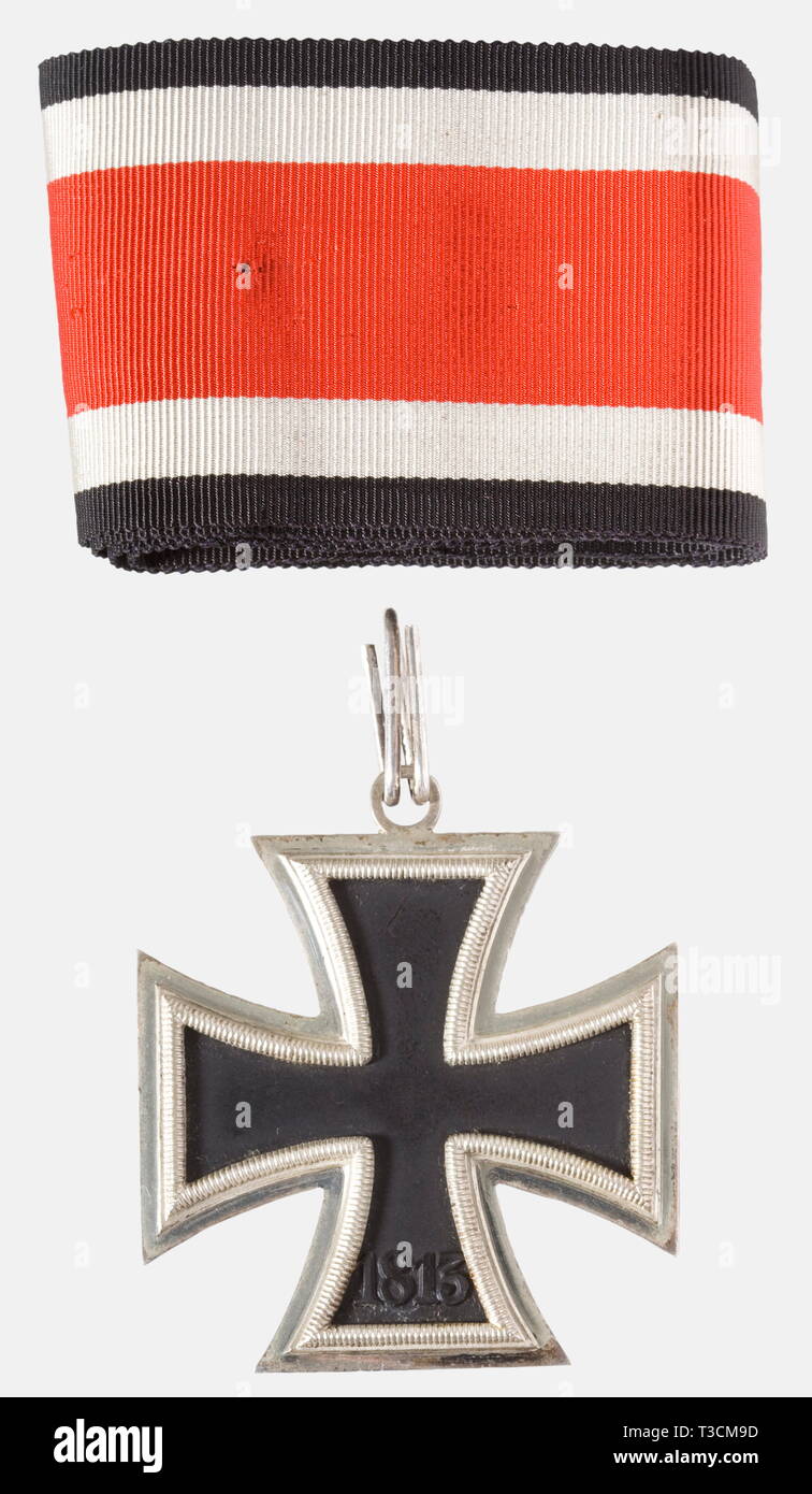 Knight's Cross of the Iron Cross 1939, manufacturer L/15, in its presentation case Blackened iron core in a polished silver frame, 'L/15' for maker Otto Schickle in Pforzheim punched in the eyelet (Nie 7.03.08 f2). Dimensions ca. 49.5 x 55.2 mm, weight ca. 25 g. Together with a ca. 55 cm length of neck ribbon, in a black award presentation case with obverse silver-stamped 'LDO', iron hinge, non-magnetic push button. Nearly unworn, the obverse somewhat toned, the ribbon with holes from thumbtacks. The consigner states this award was acquired from the family of Generalleutnan, Editorial-Use-Only Stock Photo
