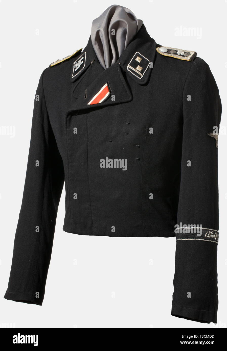 A field tunic for a Hauptscharführer, with the Armoured Reconnaissance Battalion of the SS-Leibstandarte 'Adolf Hitler' Black wool panzer troop uniform tunic, with black lining (repaired in places, added selvage). Black synthetic resin buttons (various). Iron Cross buttonhole ribbon and medal loops, Black collar patches with silver piping for an SS-officer, the right with silver embroidered runes, the left with metal stars (upgraded) and rank lace. Black felt sleeve mounted shoulder boards, with black net backing, silver lace, golden yellow piping, and the rare small versio, Editorial-Use-Only Stock Photo