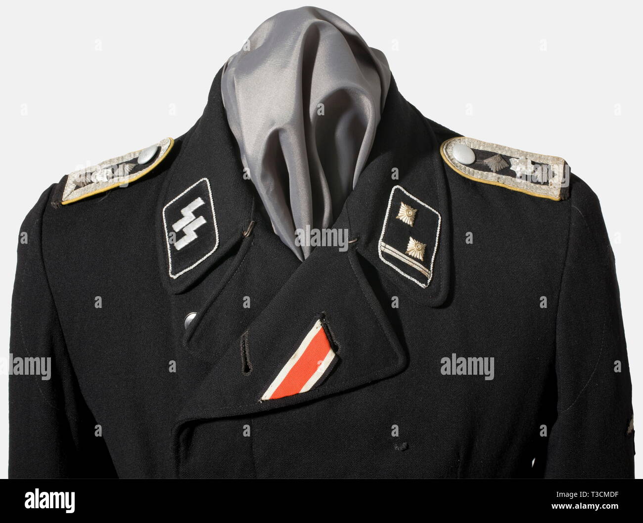 A field tunic for a Hauptscharführer, with the Armoured Reconnaissance Battalion of the SS-Leibstandarte 'Adolf Hitler' Black wool panzer troop uniform tunic, with black lining (repaired in places, added selvage). Black synthetic resin buttons (various). Iron Cross buttonhole ribbon and medal loops, Black collar patches with silver piping for an SS-officer, the right with silver embroidered runes, the left with metal stars (upgraded) and rank lace. Black felt sleeve mounted shoulder boards, with black net backing, silver lace, golden yellow piping, and the rare small versio, Editorial-Use-Only Stock Photo