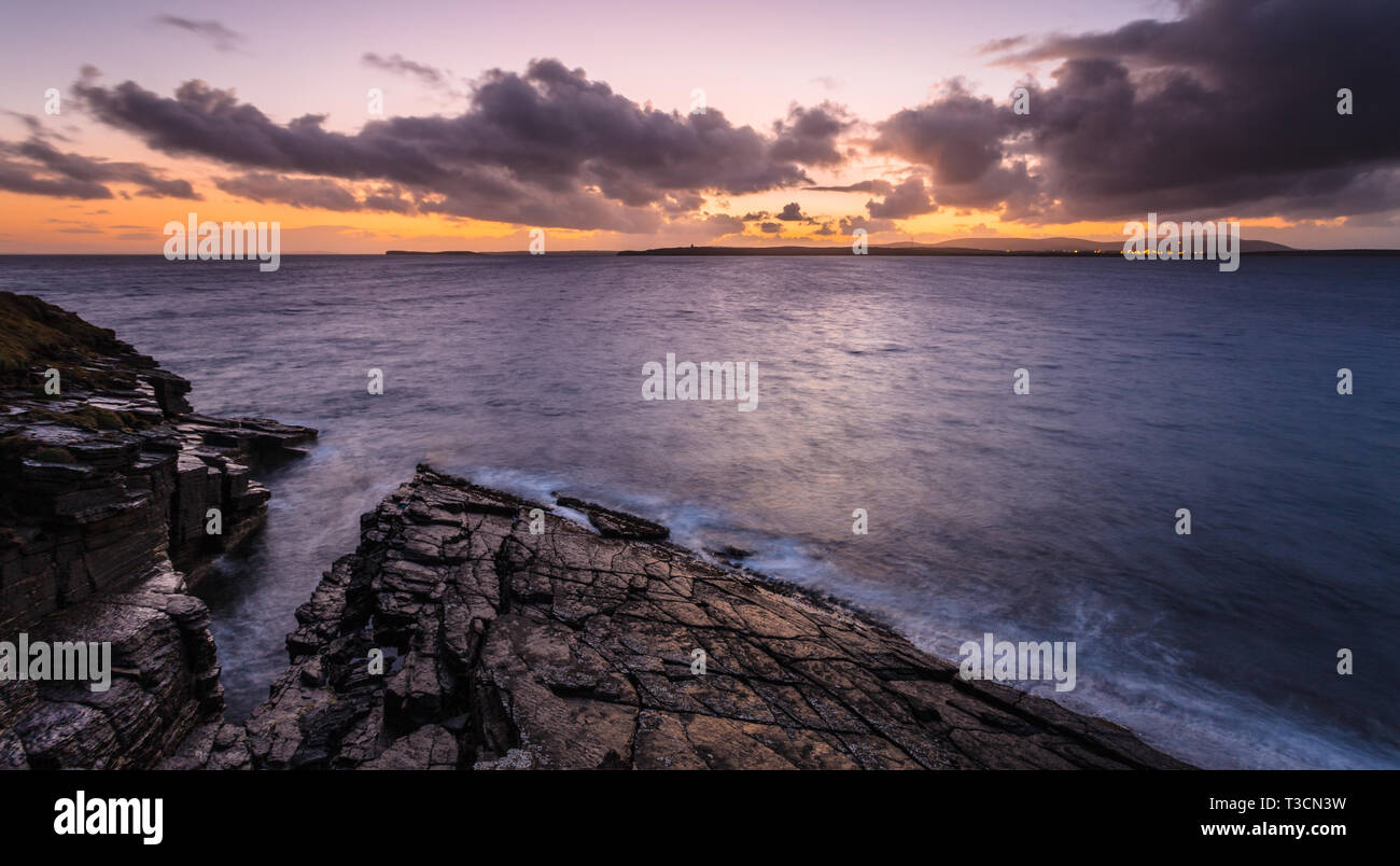 Dusk view to Flotta and Hoy across Hoxa Sound from Hoxa Head, South Ronaldsay, Orkney Islands. Stock Photo