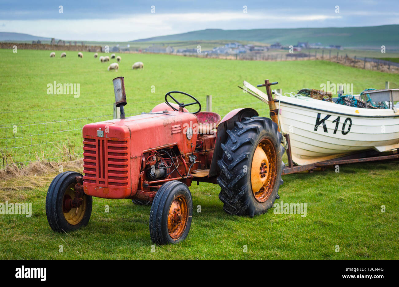 Tractor and fishing boat at Birsay, Mainland, Orkney Islands Stock Photo