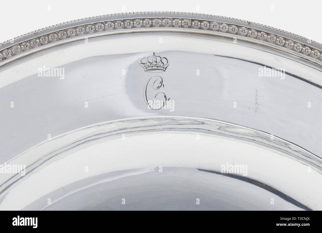 Queen Caroline of Bavaria (1776 - 1846), a silver plate from her table service, Anton Weißhaupt, Munich after 1806. Silver with the monogram 'C' below the Bavarian royal crown engraved on the border. The rim is decorated with a delicate floral frieze. The bottom bears the master's mark 'AW', the Munich Kindl (child) mark over a 'B' and the scratched marks, '2 M:15 1/4'. Diameter 30.2 cm. Weight 821 g. Very rare plate. In 1797, Princess Caroline von Baden married the then Duke Maximilian Joseph von der Pfalz-Zweibrücken, who became King of Bavaria, Additional-Rights-Clearance-Info-Not-Available Stock Photo