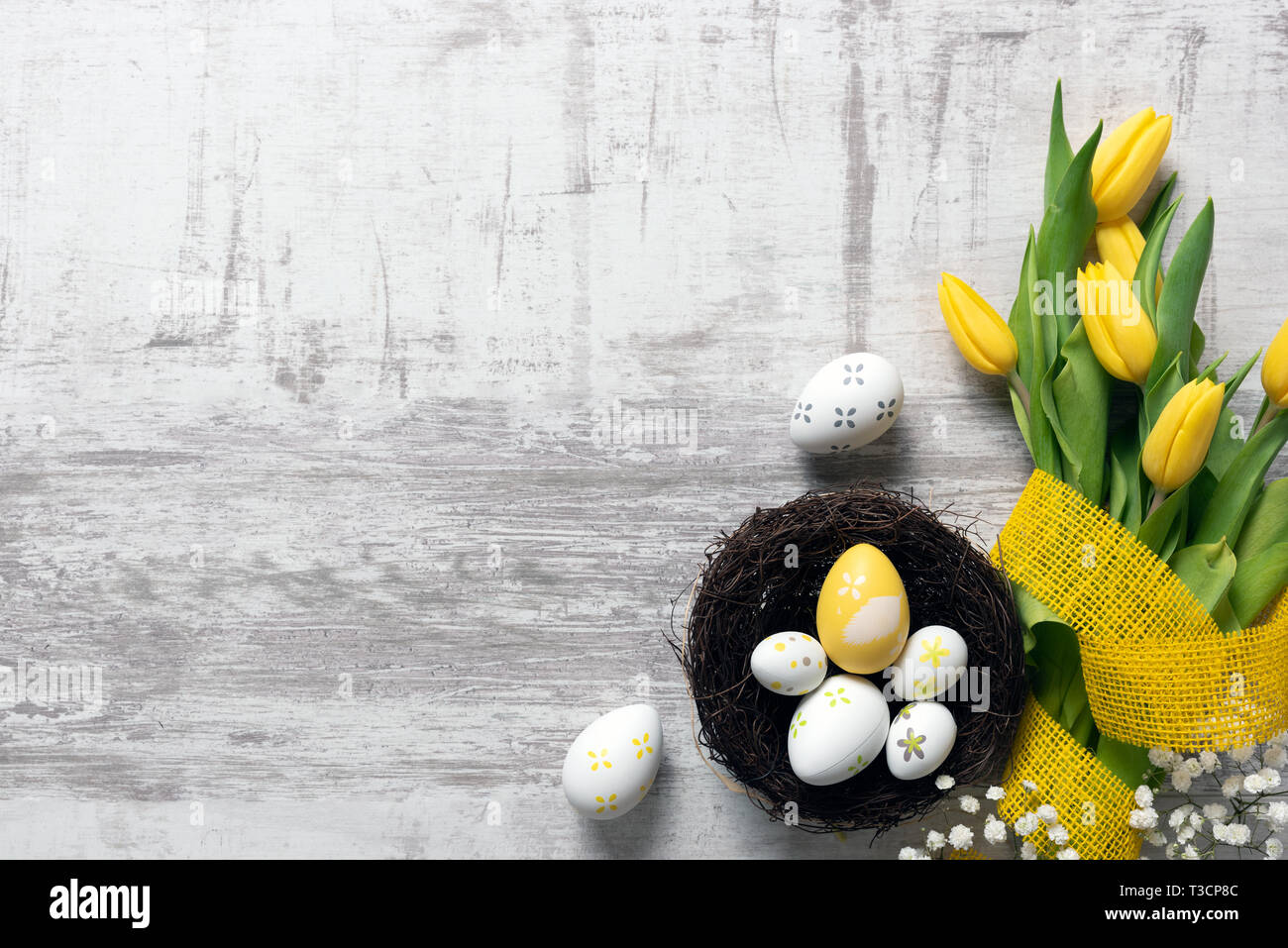 Easter eggs and spring flowers background. Top view with copy space ...
