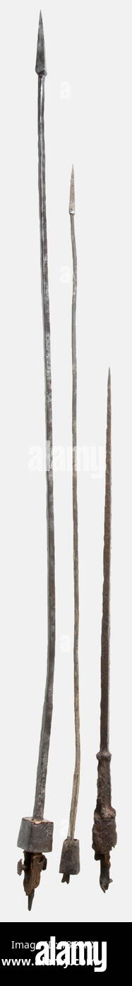 Three Roman pila, 1st - 4th century A.D. Includes a particularly large pilum with a squared iron shaft fitting, attachment rivet, and remnants of the wooden shaft, Length 102 cm. The other two pila have squared and rounded shaft fittings. Lengths 81 cm and 57.5 cm. The latter also retains remnants of the shaft. Also two iron Celtic lance heads, 3rd - 1st century B.C., 47.6 cm and 48 cm, the latter with fire patina. Axel Guttmann Collection (no inventory number). historic, historical, ancient world, ancient world, ancient times, object, objects, s, Additional-Rights-Clearance-Info-Not-Available Stock Photo