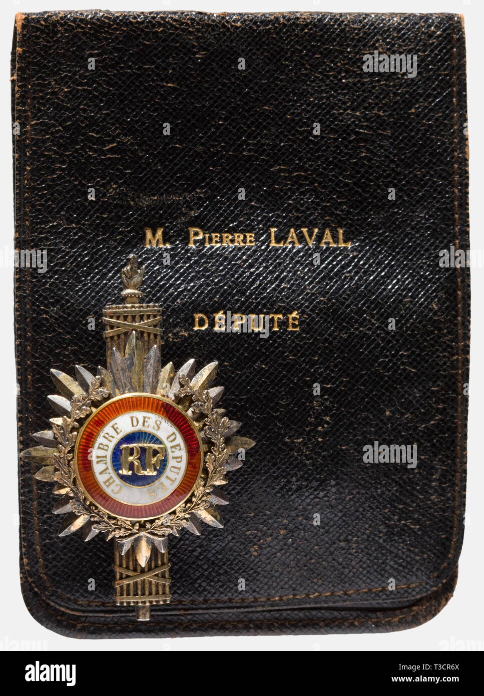 Pierre Laval (1883 - 1945), an official insignia for a deputy, period of the III Republic Gilded silver. Enamelled medallion in the national colours with the surrounding inscription, 'Chambre des Députés' and a gold oak leaf wreath bearing the gilded monogram 'RF' above one fasces. The maker's mark and hallmark are engraved on the back. In a leather case with the name, 'M. Pierre Laval, Député,' stamped in gold. Dimensions 6.5 cm x 4 cm. Weight 25.5 g. Enamel and monogram somewhat damaged. Pierre Laval was elected Deputy for the Department of the, Additional-Rights-Clearance-Info-Not-Available Stock Photo