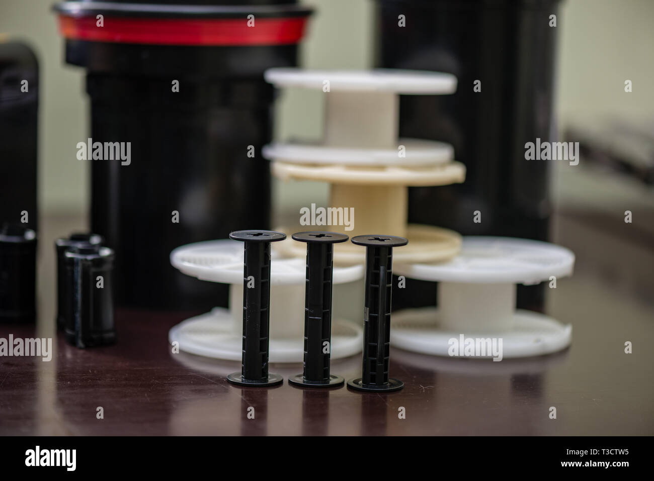details of analog film laboratory equipment on the table. film rolls ...