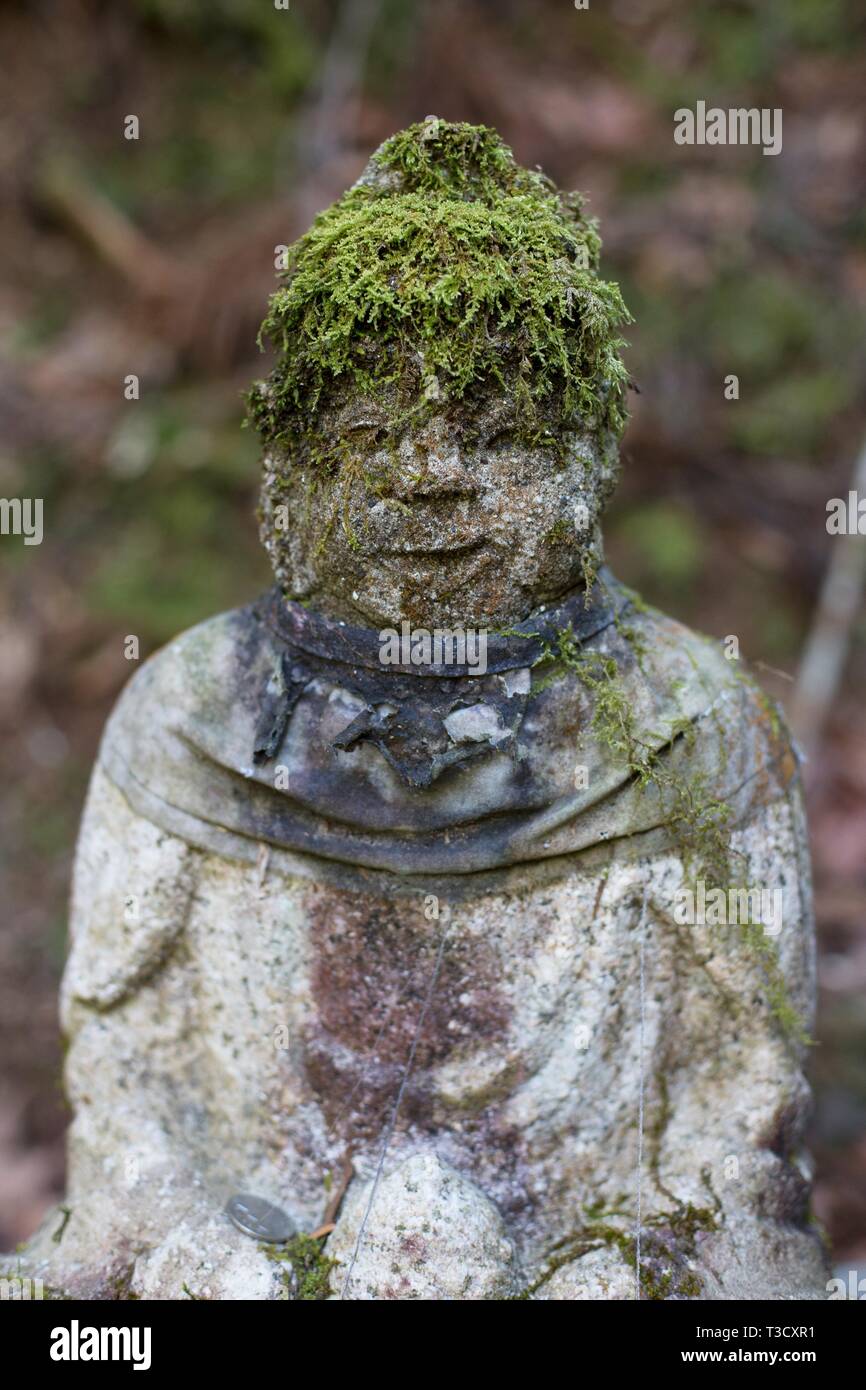 A carved stone Jizo statue in Okunoin cemetery in Koyasan, Japan Stock