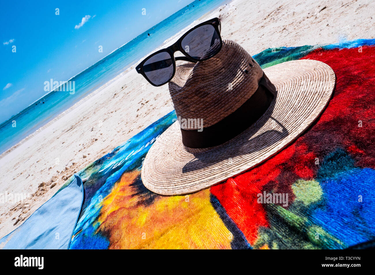 Straw hat, sun glasses and flip flops on a tropical beach, Mexico Stock ...