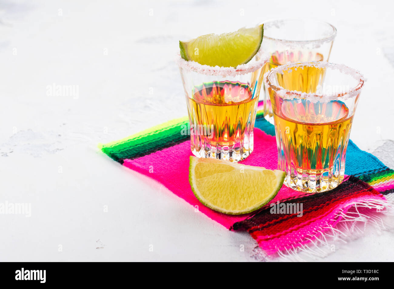 Mexican golden tequila shots Stock Photo Alamy