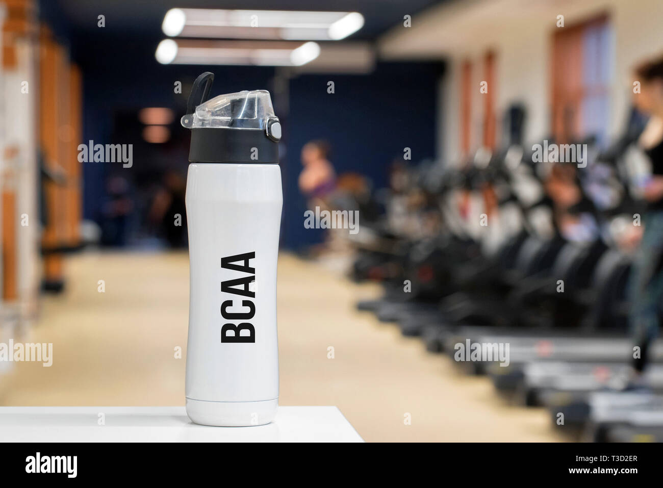 Plastic bottle or cup with fitness drink of branchedchain amino acid