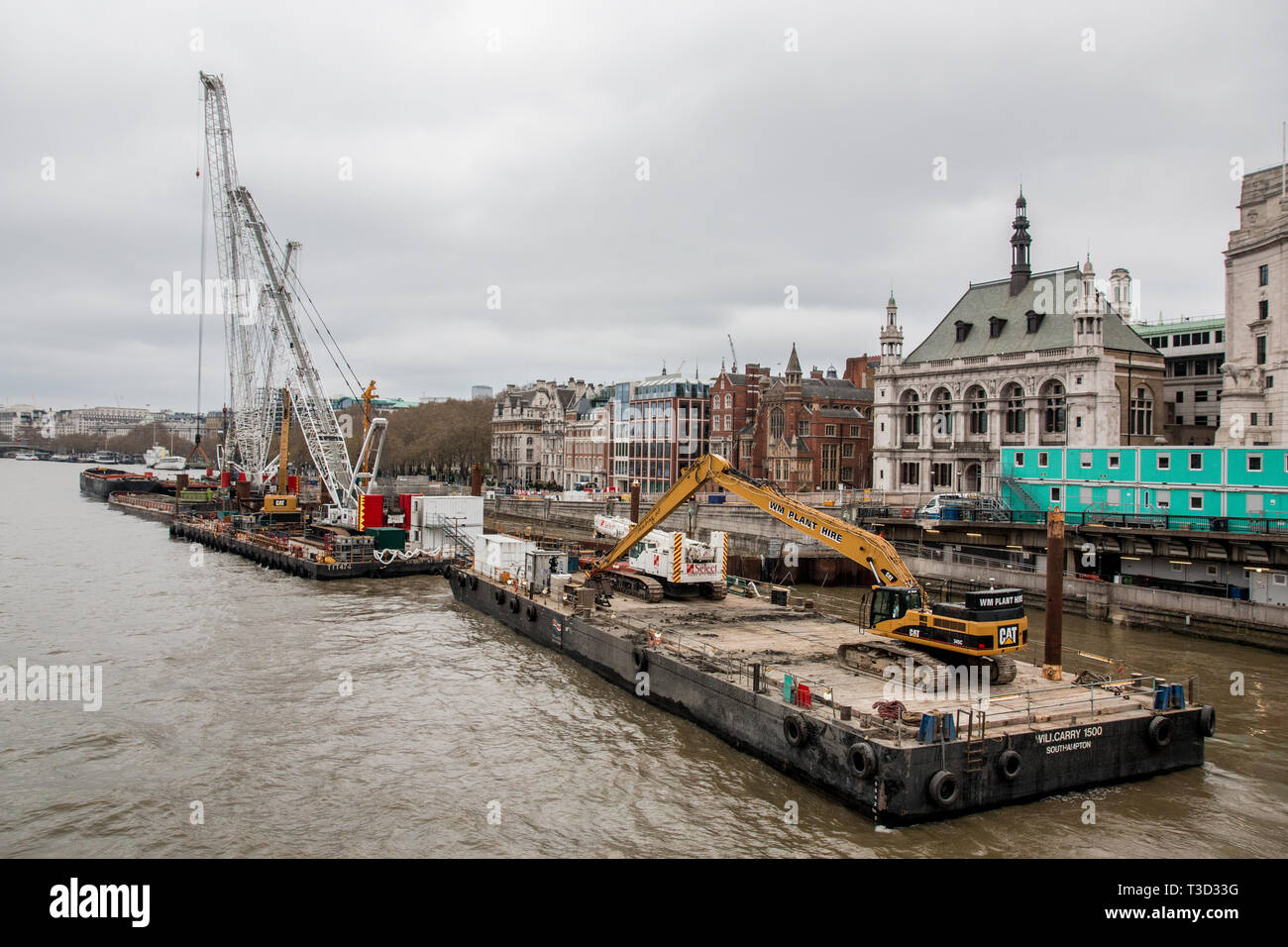 Floating construction platform on the river thames London Stock Photo