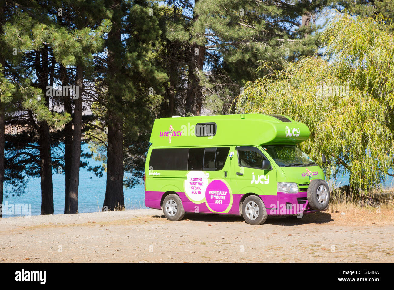 Live Jucy campervan parked, New Zealand Stock Photo