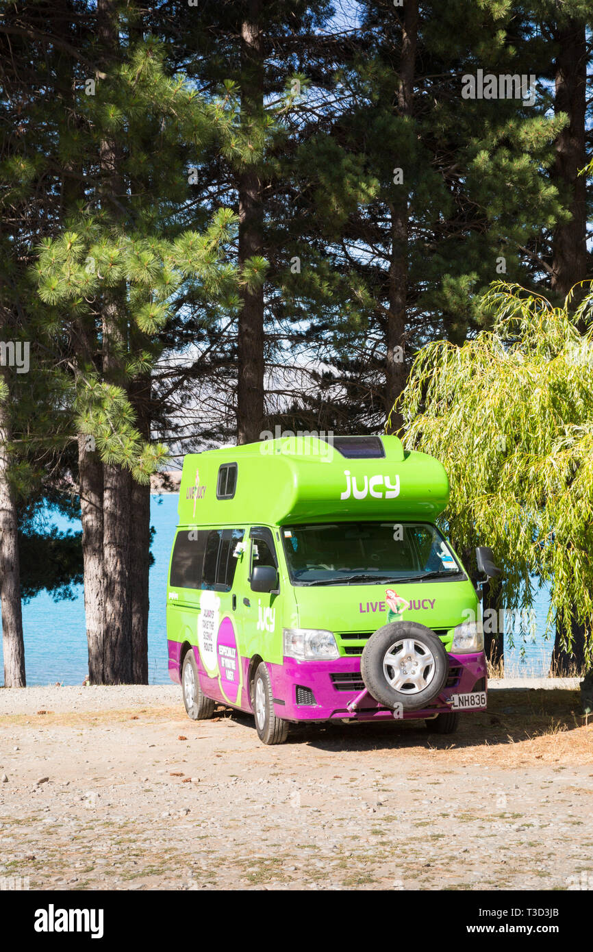 Live Jucy campervan parked, New Zealand Stock Photo
