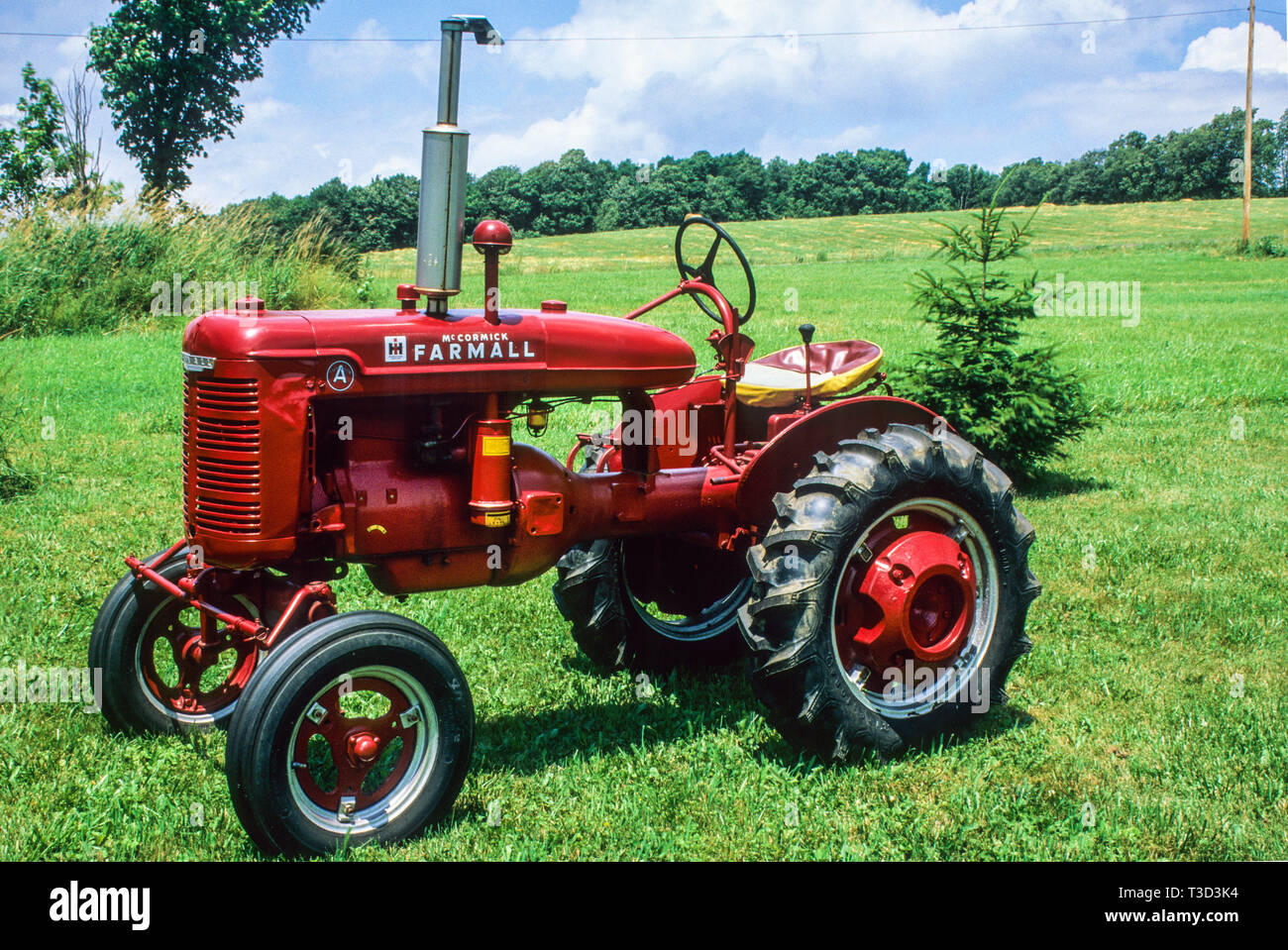 Vintage restored Mc Cormick Farmall tractor, Steuben County, New York, USA, vintage tractors spring antique images garden tool restored Stock Photo