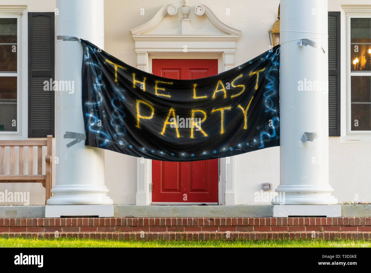 'The Last Party' banner hangs between the front columns of a fraternity house on the campus of Emory University shortly before college graduation. Stock Photo