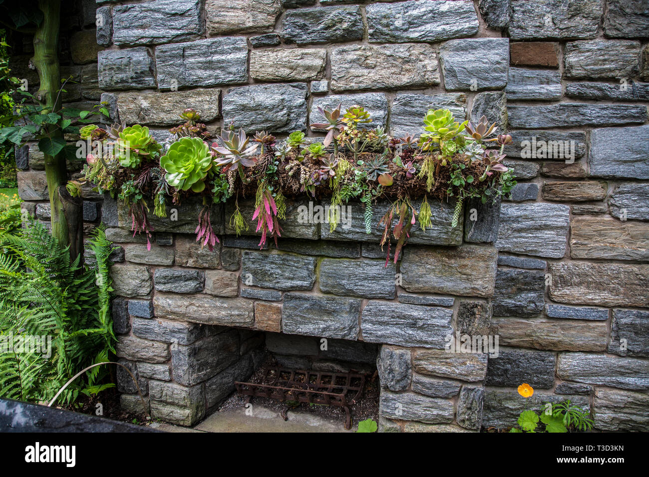 Outdoor Stone Fireplace With A Mantel Of Plants Chanticleer