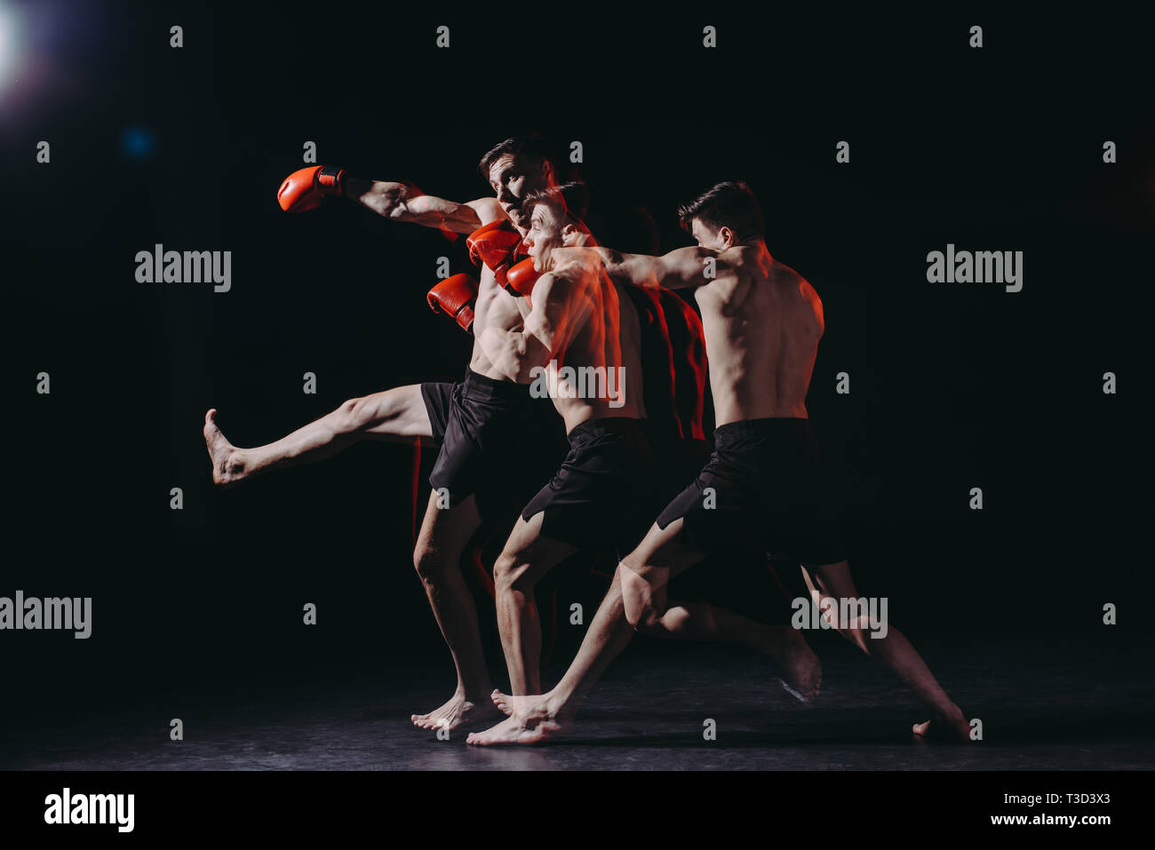 sequence shot of shirtless boxer in boxing gloves doing punch Stock