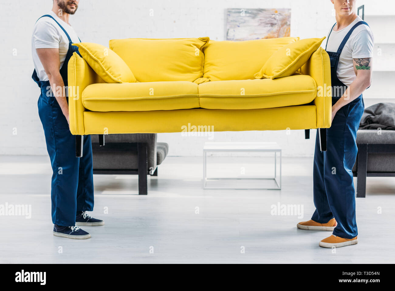 Two men moving couch apartment hi-res stock photography and images - Alamy